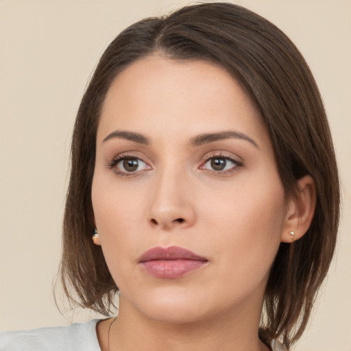 Neutral white young-adult female with medium  brown hair and brown eyes