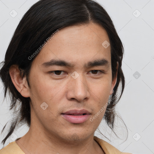 Joyful asian young-adult male with medium  brown hair and brown eyes