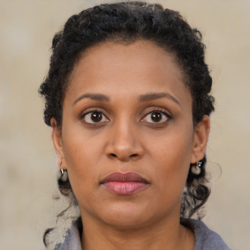 Neutral black young-adult female with short  brown hair and brown eyes