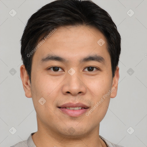 Joyful asian young-adult male with short  brown hair and brown eyes