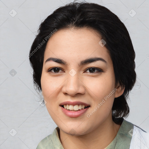 Joyful asian young-adult female with medium  black hair and brown eyes