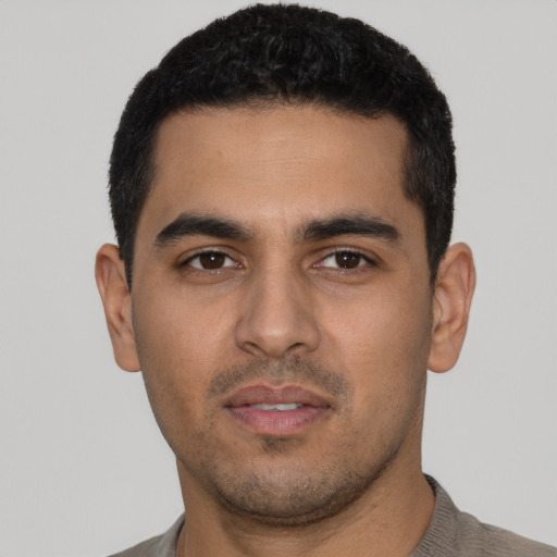 Neutral latino young-adult male with short  black hair and brown eyes