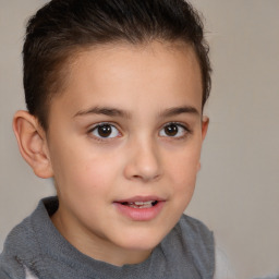 Joyful white child female with short  brown hair and brown eyes