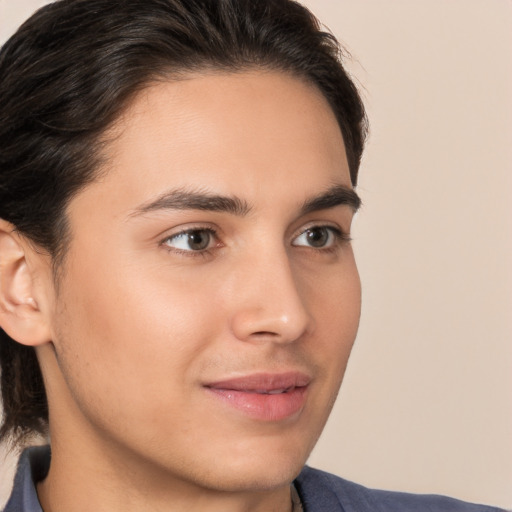 Joyful white young-adult male with medium  brown hair and brown eyes