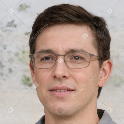 Joyful white adult male with short  brown hair and grey eyes