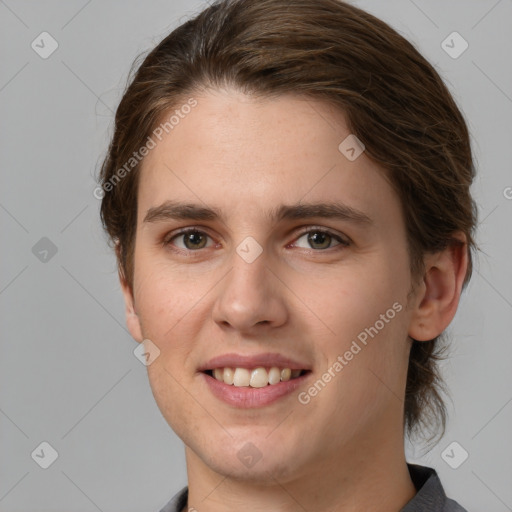 Joyful white young-adult female with medium  brown hair and grey eyes