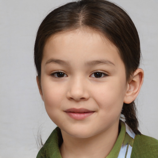 Joyful asian child female with medium  brown hair and brown eyes