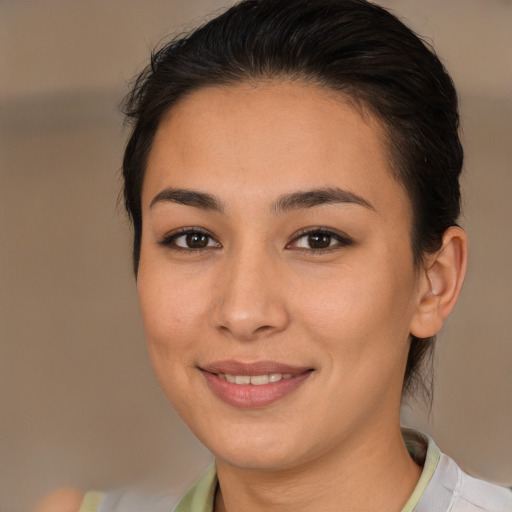 Joyful latino young-adult female with medium  brown hair and brown eyes