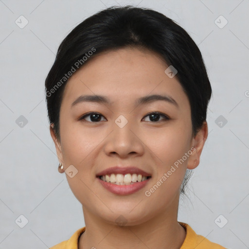 Joyful asian young-adult female with short  black hair and brown eyes