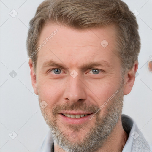 Joyful white adult male with short  brown hair and grey eyes