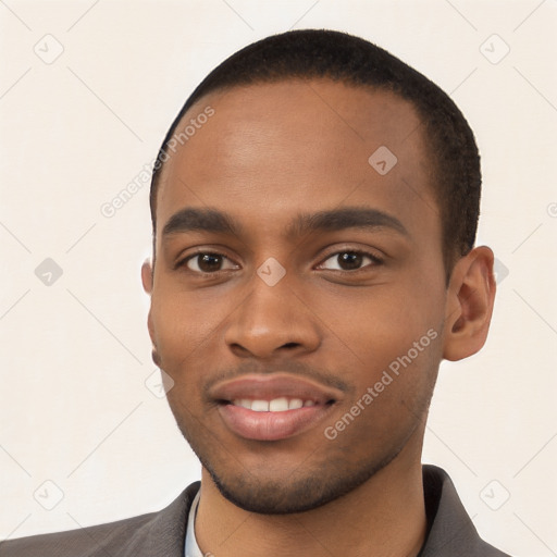 Joyful black young-adult male with short  black hair and brown eyes