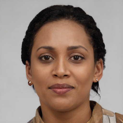 Joyful latino young-adult female with short  black hair and brown eyes