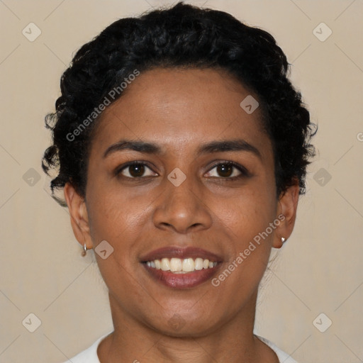 Joyful black young-adult female with short  black hair and brown eyes