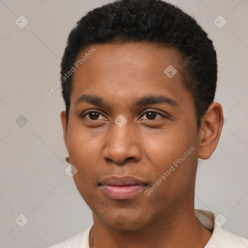 Joyful black young-adult male with short  brown hair and brown eyes