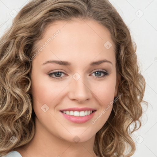 Joyful white young-adult female with long  brown hair and green eyes