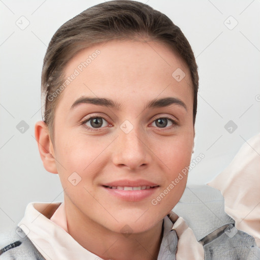 Joyful white young-adult female with short  brown hair and grey eyes