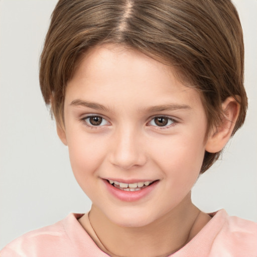 Joyful white child female with short  brown hair and brown eyes