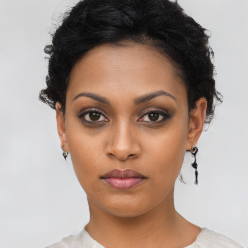 Neutral latino young-adult female with short  black hair and brown eyes