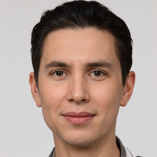 Joyful white young-adult male with short  brown hair and brown eyes