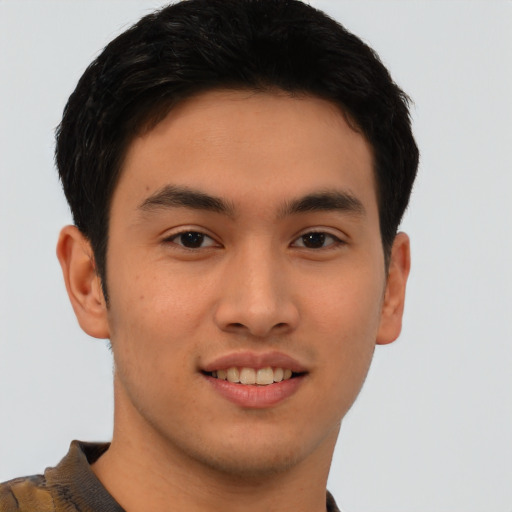 Joyful asian young-adult male with short  brown hair and brown eyes