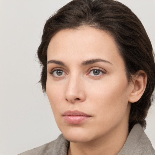 Neutral white young-adult female with medium  brown hair and brown eyes