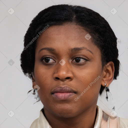 Joyful black young-adult female with medium  black hair and brown eyes