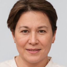 Joyful white adult female with short  brown hair and brown eyes