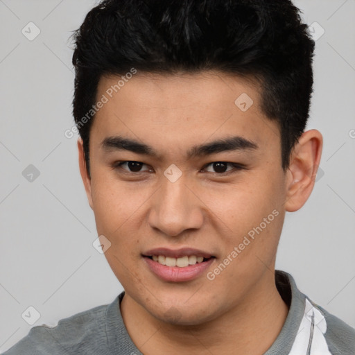 Joyful asian young-adult male with short  brown hair and brown eyes