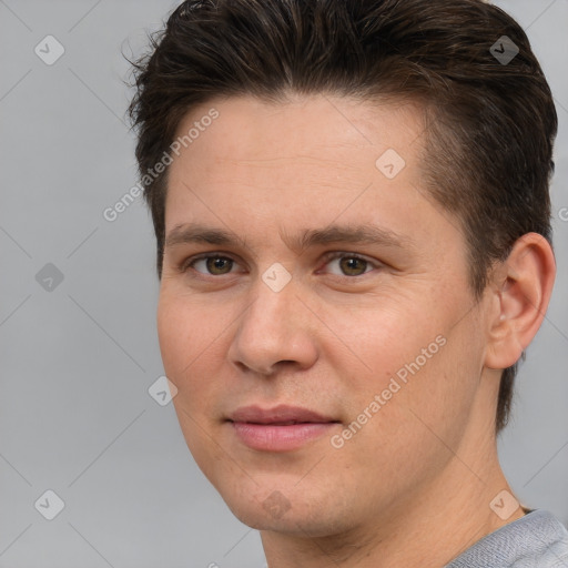 Joyful white adult male with short  brown hair and brown eyes