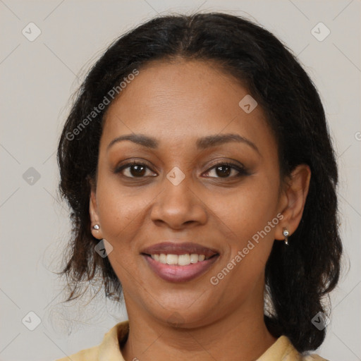 Joyful black young-adult female with medium  brown hair and brown eyes