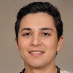 Joyful white young-adult male with short  black hair and brown eyes