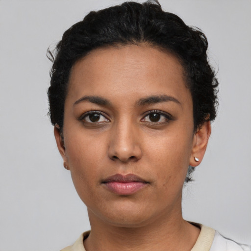 Neutral latino young-adult female with short  black hair and brown eyes