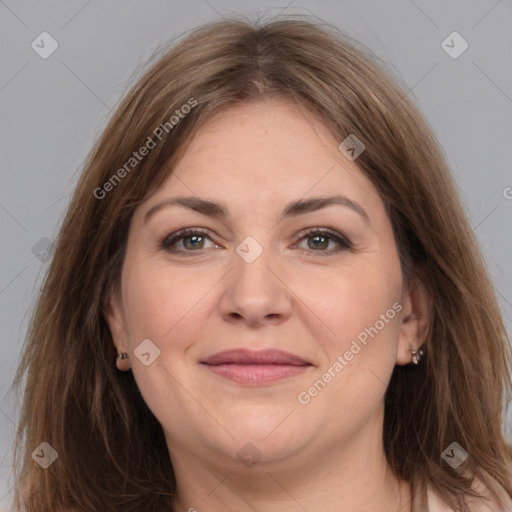 Joyful white adult female with long  brown hair and brown eyes