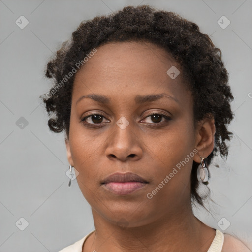 Neutral black young-adult female with short  brown hair and brown eyes