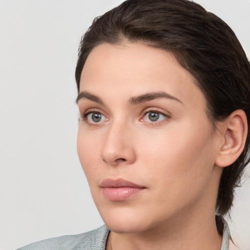 Neutral white young-adult female with medium  brown hair and brown eyes