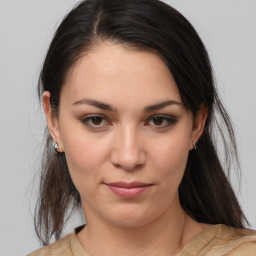 Joyful white young-adult female with medium  brown hair and brown eyes