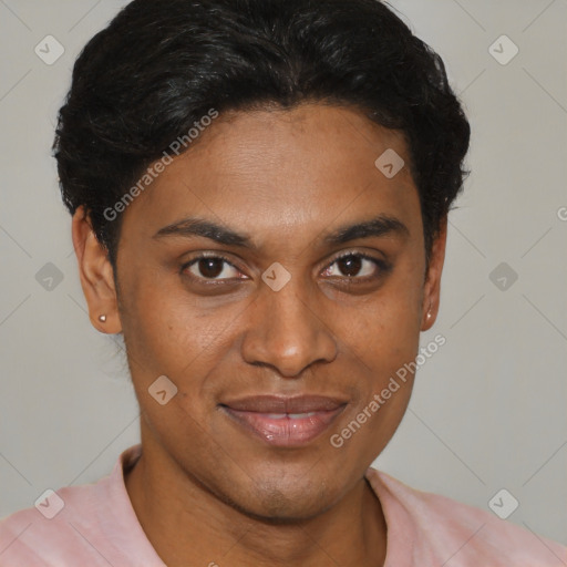 Joyful black young-adult male with short  brown hair and brown eyes