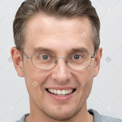 Joyful white adult male with short  brown hair and grey eyes