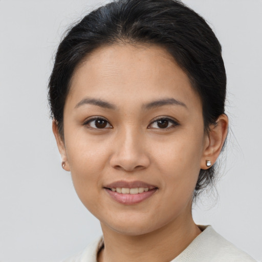 Joyful white young-adult female with medium  brown hair and brown eyes