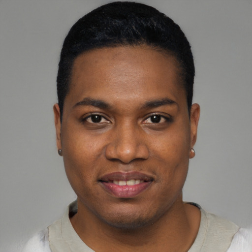 Joyful black young-adult male with short  black hair and brown eyes