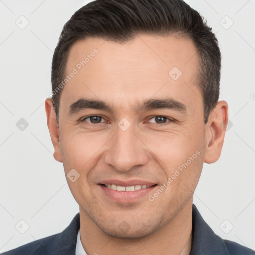 Joyful white young-adult male with short  brown hair and brown eyes