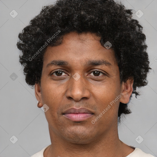 Joyful latino young-adult male with short  brown hair and brown eyes