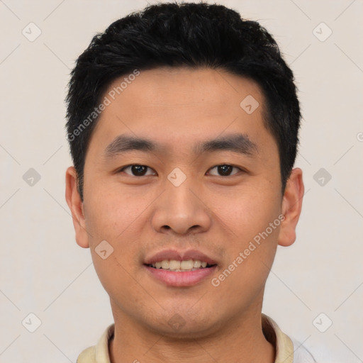 Joyful asian young-adult male with short  black hair and brown eyes