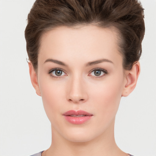 Neutral white young-adult female with short  brown hair and brown eyes