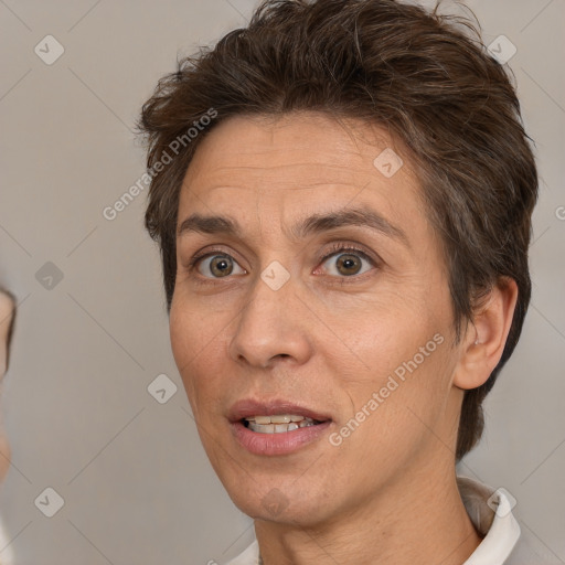 Joyful white adult female with short  brown hair and brown eyes