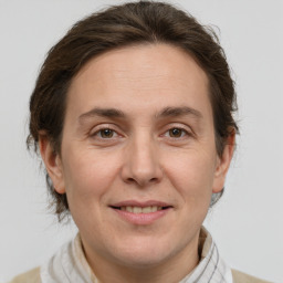 Joyful white adult female with short  brown hair and brown eyes