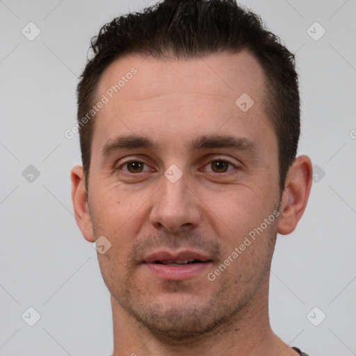 Joyful white young-adult male with short  brown hair and brown eyes