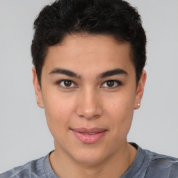 Joyful latino young-adult male with short  brown hair and brown eyes