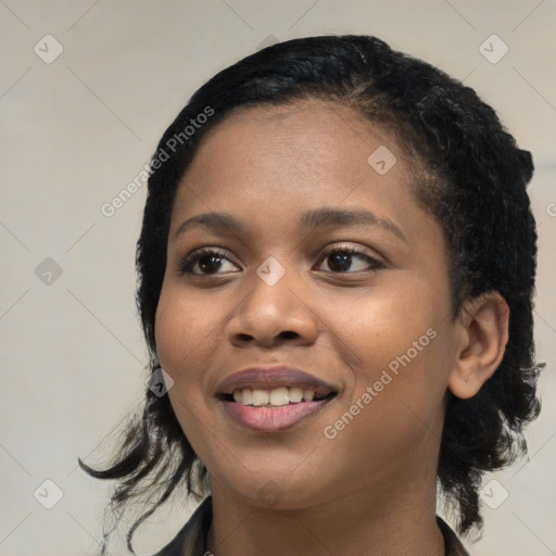 Joyful black young-adult female with medium  black hair and brown eyes