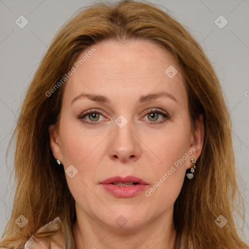 Joyful white adult female with long  brown hair and brown eyes